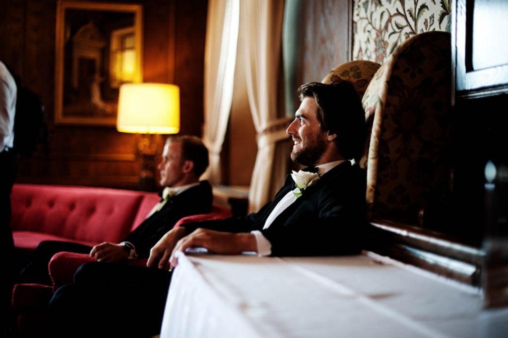 Gentleman smiling while sitting in a large chair